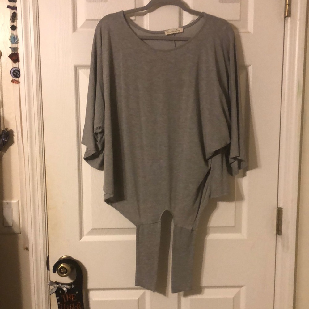 Gray batwing style top with tie bottom.